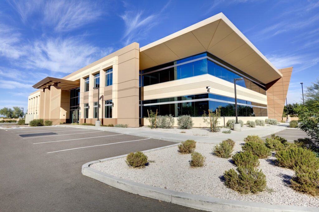 Davin Property Management: A office building against a blue sky.